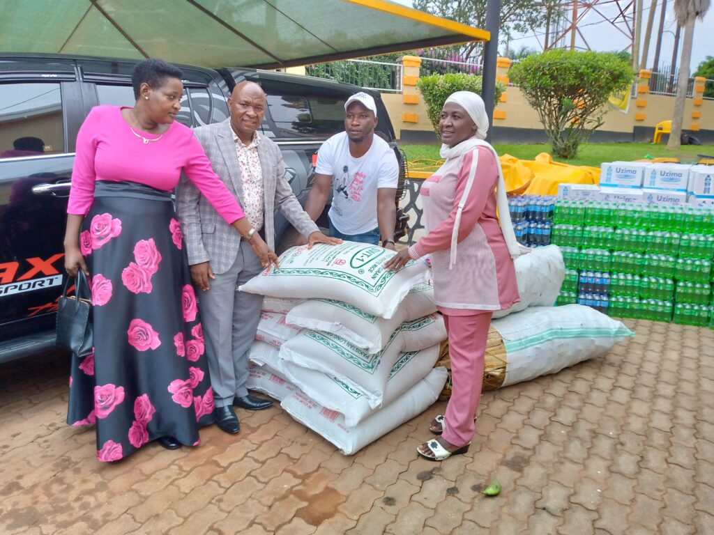Hajat Uzeiye Namyalo hands over rice to Wakiso leaders