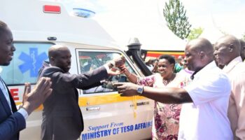 VP Alupo hands over the ambulance to Amuria officials as state minister Obote looks on